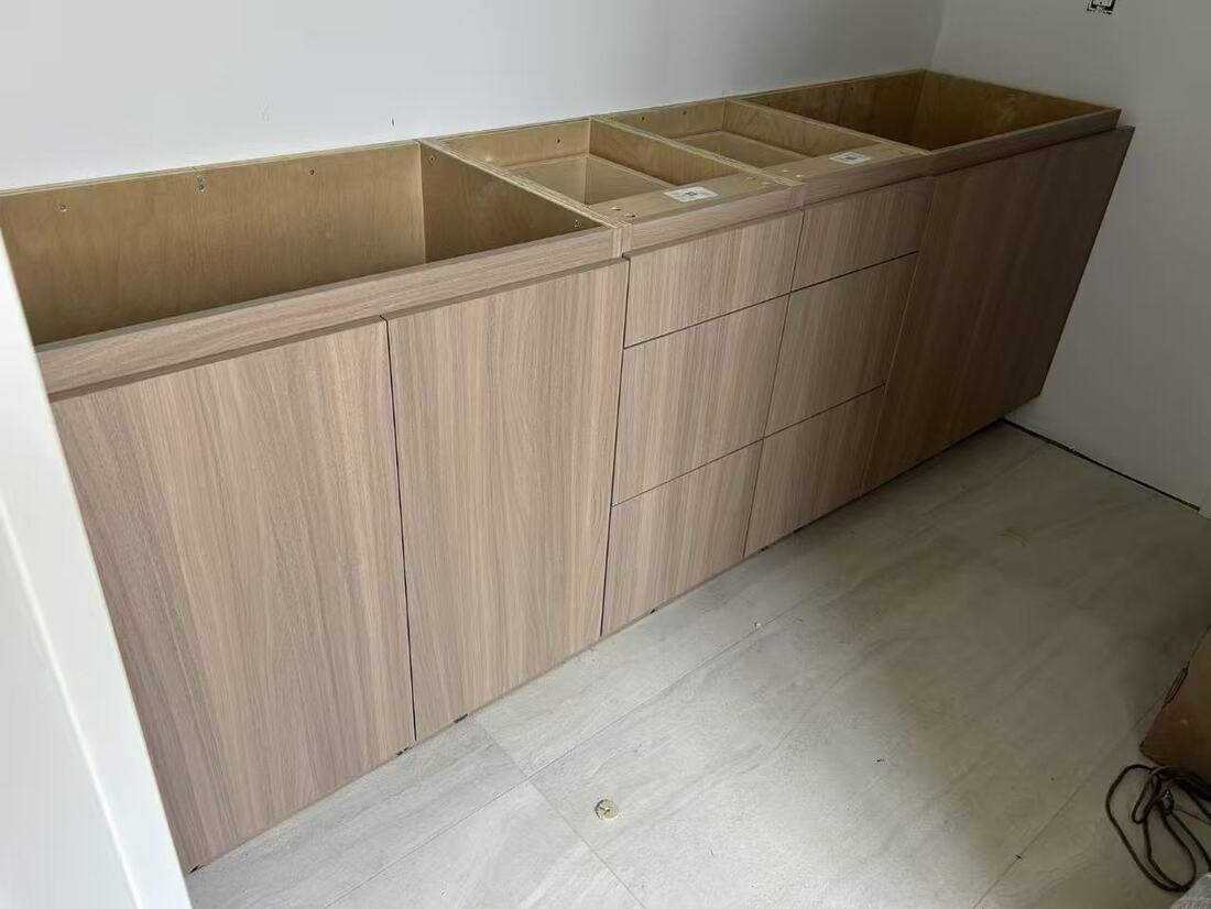 A run of base drawers in matching woodgrain