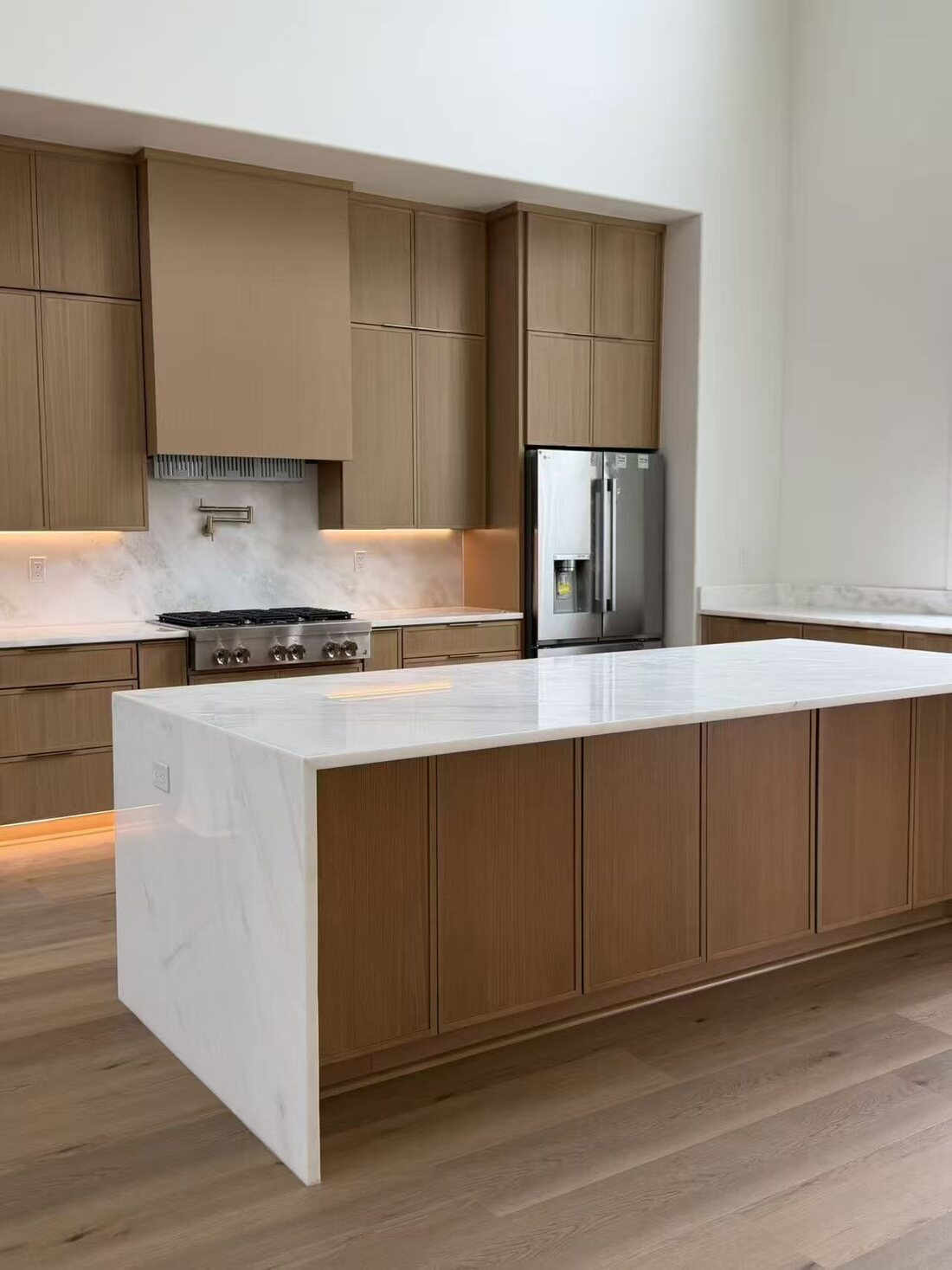 Continuous LED glow beneath wall cabinets