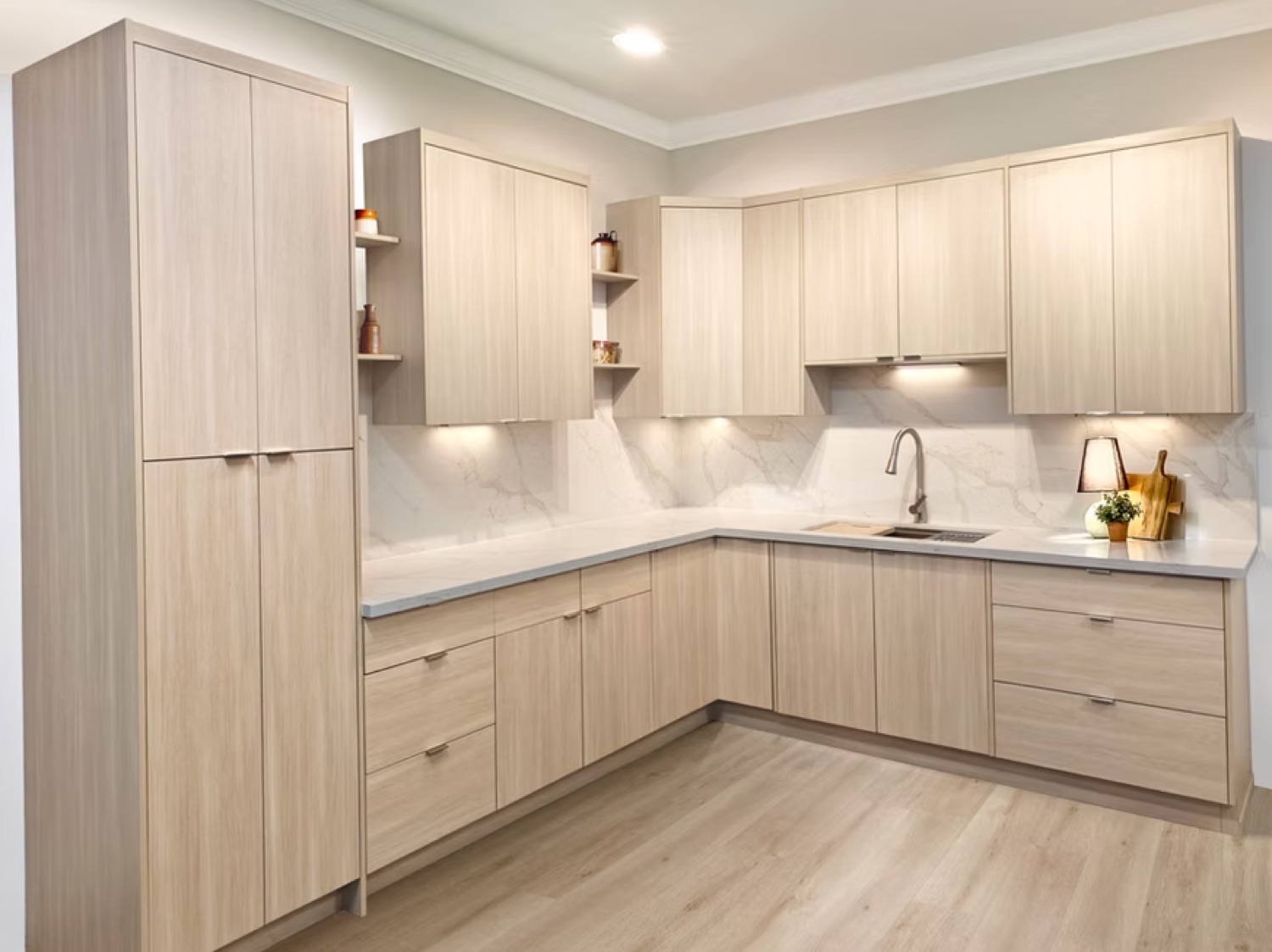 Shaker kitchen — real Luxova install in light oak with marble backsplash