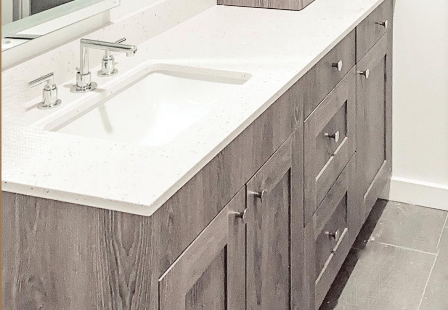 Weathered-oak shaker vanity with a quartz top and undermount sink