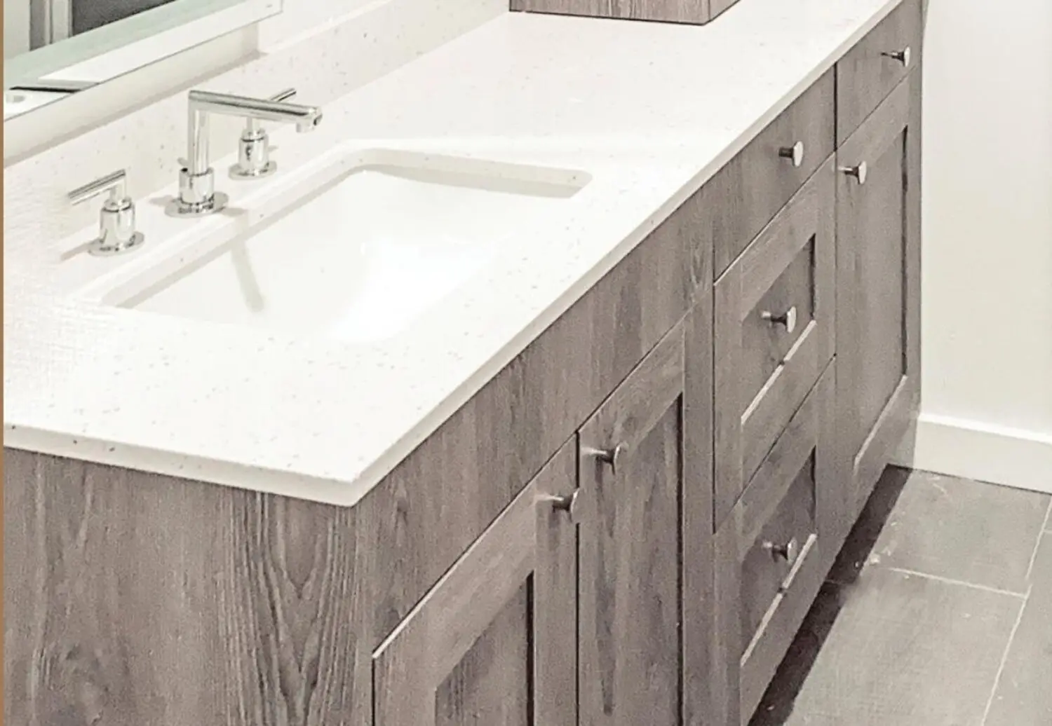 Weathered-oak shaker vanity with a quartz top and undermount sink